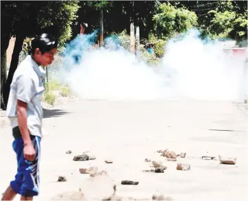  ??  ?? A homemade bomb explodes near a barricade in the indigenous community of Monimbo in Masaya, Nicaragua. — Reuters photo