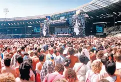  ??  ?? ‘Everyone was supporting each other’: crowds at Live Aid in Wembley