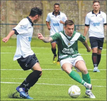  ??  ?? Ashford’s Rory Hill tries some trickery against Ramsgate on Saturday