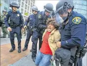  ?? Howard Lipin San Diego Union-Tribune ?? POLICE arrested 35 people at the protest. Ten plaintiffs say their freedom of speech was suppressed.