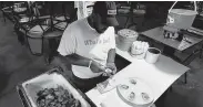  ?? William Luther / Staff photograph­er ?? PJ Scott at Rockport’s Boiling Pot shucks some of the last fresh oysters from Aransas Bay.