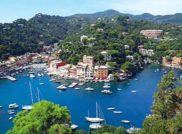  ??  ?? A B O V E AND LEFT Portofino’s tiny harbour is a magnet for visiting boats but berths are few and far between and prices reflect its exclusive nature