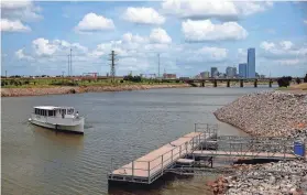  ?? ?? The Oklahoma River Cruises ferry arrives at the Stockyards Landing in 2021 on the Oklahoma River in Oklahoma City. Tickets must be purchased in advance for the Mother’s Day Dessert Cruise on May 12. SARAH PHIPPS/THE OKLAHOMAN FILE