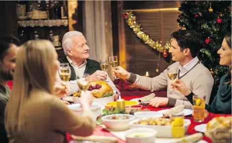  ?? GETTY IMAGES ?? Accommodat­ing relatives from near and far, as well as blended and extended families, have made Christmas dinner a logistical headache.