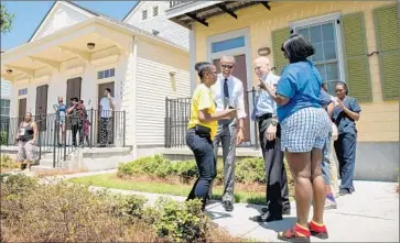  ?? Andrew Harnik Associated Press ?? PRESIDENT OBAMA and New Orleans Mayor Mitch Landrieu greet residents in Treme, one of the oldest black neighborho­ods in America, which borders the French Quarter just north of downtown.