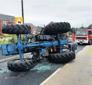  ?? GMP Rochdale ?? ●●The tractor overturned on Broad Lane