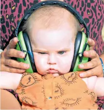  ??  ?? Five-month-old Nancy Ashford attends the Womad festival at Charlton Park near Malmesbury in Wiltshire. The event began on Thursday and ends today.