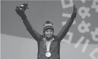  ?? LINNEA RHEBORG/GETTY IMAGES ?? Natalie Wilkie of Canada celebrates her bronze-medal finish in the women’s 1.5km cross-country skiing sprint classic during the Paralympic Games on Wednesday in Pyeongchan­g.