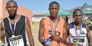  ?? Pictures: ANDISA BONANI ?? GOT THIS: Winners of the Phakama Athletics Club 12km road run on Saturday in Komani were, from left, the overall winner Muhle Fanteni, in second place Sive Tshokotsha and in third place Zukile Vellem