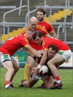  ??  ?? Conor Carty of Castletown is surrounded by Starlights quartet Rory O’Connor, Tom Wall, Jack Kelly and Kevin Foley.