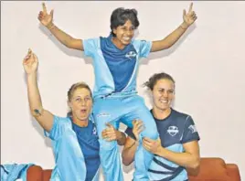  ?? BCCI ?? Supernovas’ Poonam Yadav (centre) with New Zealand’s Sophie Devine (left) and England’s Natalie Sciver celebrate after winning the Women's T20 Challenge in Jaipur.