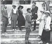  ?? LIBRARY OF CONGRESS ?? National Woman’s Party members thanking legislator­s outside the State Capitol after the vote. Harry Burn is in the dark suit just right of center, in the background, shaking hands with Anita Pollitzer. At far left is Banks Turner, shaking hands with Catherine Flanagan. In front are Thomas Simpson and NWP activists Betty Gram and Sue White.