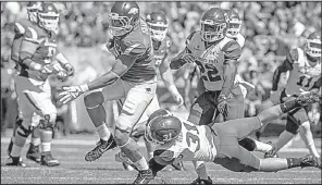  ?? NWA Democrat-Gazette/BEN GOFF ?? Arkansas tight end Cheyenne O’Grady breaks New Mexico State linebacker Dalton Herrington’s tackle Saturday at Reynolds Razorback Stadium in Fayettevil­le. The Razorbacks lead the SEC in third-down conversion­s and are 10th in the nation.