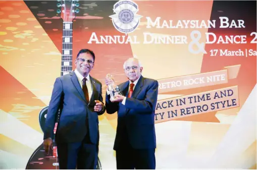  ??  ?? Great honour: Param (right) receiving the Malaysian Bar’s Lifetime Achievemen­t Award from current president George Varughese. – Courtesy of the Bar Council