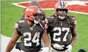  ?? AP-Ron Schwane ?? Cleveland Browns running backs Nick Chubb and Kareem Hunt walk off the field after an NFL football gameon Nov. 15. Cleveland’s dynamic duo of backs combined for 230 yards and helped the Browns (6-3) chew up the final five minutes in a 10-7 win over the Texans.