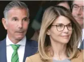  ??  ?? Actress Lori Loughlin and her husband, clothing designer Mossimo Giannulli, in 2019. AP FILES