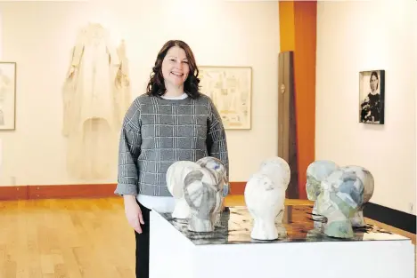  ?? NICK PROCAYLO ?? Artist Tracy McMenemy is surrounded by works from her exhibition The Girls Are Coming! being shown at the Maritime Museum in Vancouver. The exhibition is inspired by the “bride ship” Tynemouth, which brought 60 women and girls to Victoria from London in 1862.