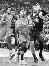  ?? FRANK GUNN/ASSOCIATED PRES ?? Raptors G Kyle Lowry, who had 11 points, drives past Magic C Nikola Vucevic, who had 10 points and 9 rebounds.