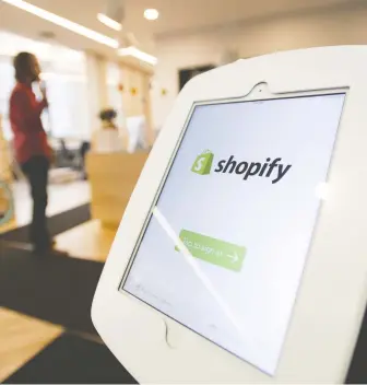  ?? KEVIN VAN PaaSSEN/BLOOMBERG FILES ?? Shopify is one of the winners after a brutal selloff in March from COVID-19 shutdowns. It is now Canada’s largest publicly traded company, gaining from a spike in online shopping.