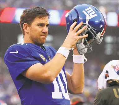  ?? Rich Schultz / Associated Press ?? Despite struggling through a 1-win season thus far, Giants QB Eli Manning says he isn’t ready to sit in favor of younger players.