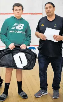  ?? ?? Cade Eriksen with his new Prince bag and Central Squash junior convener Melville Holmes.