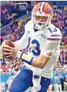  ?? SCOTT CUNNINGHAM/GETTY ?? UF quarterbac­k Feleipe Franks said he won’t trade football for baseball even though he was drafted by the Red Sox.