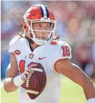  ??  ?? Clemson quarterbac­k Trevor Lawrence rolls out against Florida State on Saturday. GLENN BEIL/USA TODAY