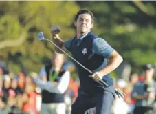  ?? Charlie Riedel, The Associated Press ?? Europe’s Rory McIlroy reacts after making his putt to win his match 3 and 2 during a four-balls match Friday at the Ryder Cup golf tournament.