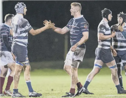  ??  ?? 0 Players shake hands at full-time in the FOSROC Super6 match between Watsonians and Heriot’s at Myreside on 14 Febuary.