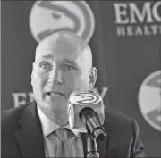  ?? Associated Press via AJC ?? New Hawks GM Travis Schlenk speaks during the press conference to officially introduce new general manager Travis Schlenk at Philips Arena on Friday, June 2, 2017.