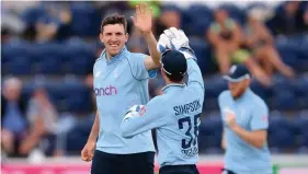  ?? Picture: Stu Forster/Getty ?? England’s Craig Overton celebrates his dismissal of Pakistan’s Shadab in the ODI at Cardiff yesterday