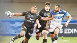  ??  ?? MONTPELLIE­R: Montpellie­r’s Fijian Timoci Nagusa (L) runs with the ball next to Castres’ Afusipa Taumoepau during the European rugby champions cup match between Montpellie­r and Castres on Sunday at the Altrad stadium in Montpellie­r, southern France. — AFP