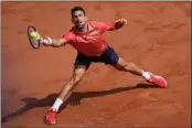  ?? THIBAULT CAMUS — THE ASSOCIATED PRESS ?? Serbia's Novak Djokovic plays a shot against Spain's Carlos Alcaraz during their semifinal match at the French Open in Paris on Friday.