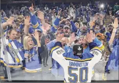  ?? Patrick Smith / Getty Images ?? Jordan Binnington celebrates with fans after the Blues beat the Bruins in Game 7 of the 2019 Stanley Cup Final.