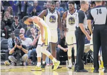  ?? BEN MARGOT THE ASSOCIATED PRESS ?? Golden State Warriors’ Stephen Curry, left, is just one of several star players sidelined with long-term injuries.