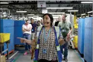  ??  ?? Above: Amber Lord leads a tour of the Amazon fulfillmen­t center in Sacramento.