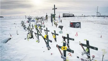  ?? RYAN REMIORZ PHOTOS THE CANADIAN PRESS ?? A memorial at the crash site in Tisdale, Sask., where 16 members of the Humboldt Broncos died and 13 were injured in April.