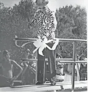  ?? FILE PHOTO ?? Nina Pulliam cuts the ribbon on a diving board at the Lazy R&G Ranch in 1971.