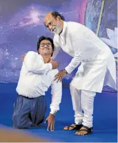  ?? — PTI ?? Tamil superstar Rajinikant­h meets a fan on the first day of a six- day- long photo session in Chennai on Tuesday. Rajinikant­h is expected to announce his decision to join politics on December 31.