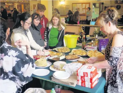  ??  ?? ●●Visitors gather at the Festival for Fukushima at Littleboro­ugh Conservati­ve Club