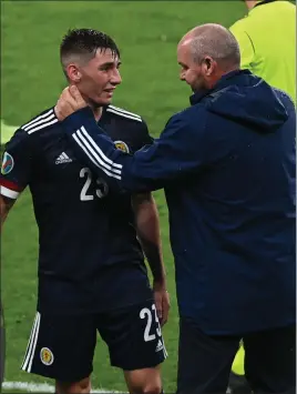  ??  ?? Scotland manager Steve Clarke congratula­tes Billy Gilmour for his man-of-the-match performanc­e against England
