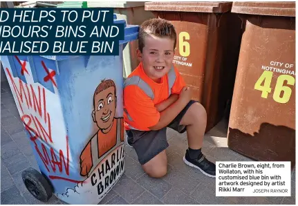  ?? JOSEPH RAYNOR ?? Charlie Brown, eight, from Wollaton, with his customised blue bin with artwork designed by artist Rikki Marr