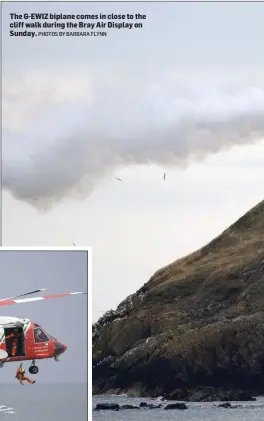  ?? PHOTOS BY BARBARA FLYNN ?? The G-EWIZ biplane comes in close to the cliff walk during the Bray Air Display on Sunday.