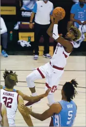  ?? KATHY KMONICEK — THE ASSOCIATED PRESS ?? Stanford’s Daejon Davis soars past North Carolina’s Armando Bacot on the way to the basket Tuesday.