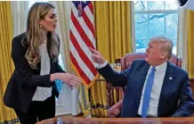  ??  ?? Mouthpiece: Hope Hicks with Donald Trump