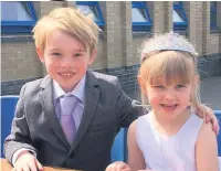  ??  ?? Harry and Lily, from year one at Prestbury Primary School, channelled Prince Harry and Meghan for the day