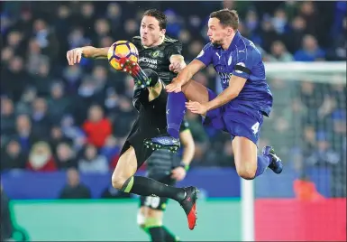  ?? DARREN STAPLES / REUTERS ?? Leicester City's Danny Drinkwater (left) battles Chelsea's Nemanja Matic for possession during their English Premier League match on Saturday. Chelsea won 3-0.
