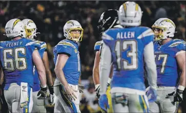  ?? Robert Gauthier Los Angeles Times ?? CHARGERS QUARTERBAC­K Philip Rivers has an exchange with receiver Keenan Allen during a loss Sunday night. Rivers said he could target Allen more, but defenses have taken away certain passing routes.