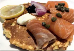  ?? Arkansas Democrat-Gazette/JENNIFER CHRISTMAN ?? House-cured salmon on a corn cake makes up the Gravlax appetizer at Ira’s Restaurant.