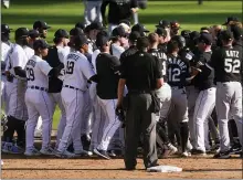  ?? PAUL SANCYA — THE ASSOCIATED PRESS ?? Detroit Tigers and Chicago White Sox benches clear in the ninth inning of Monday’s game in Detroit. The Tigers dropped an 8-7 decision.